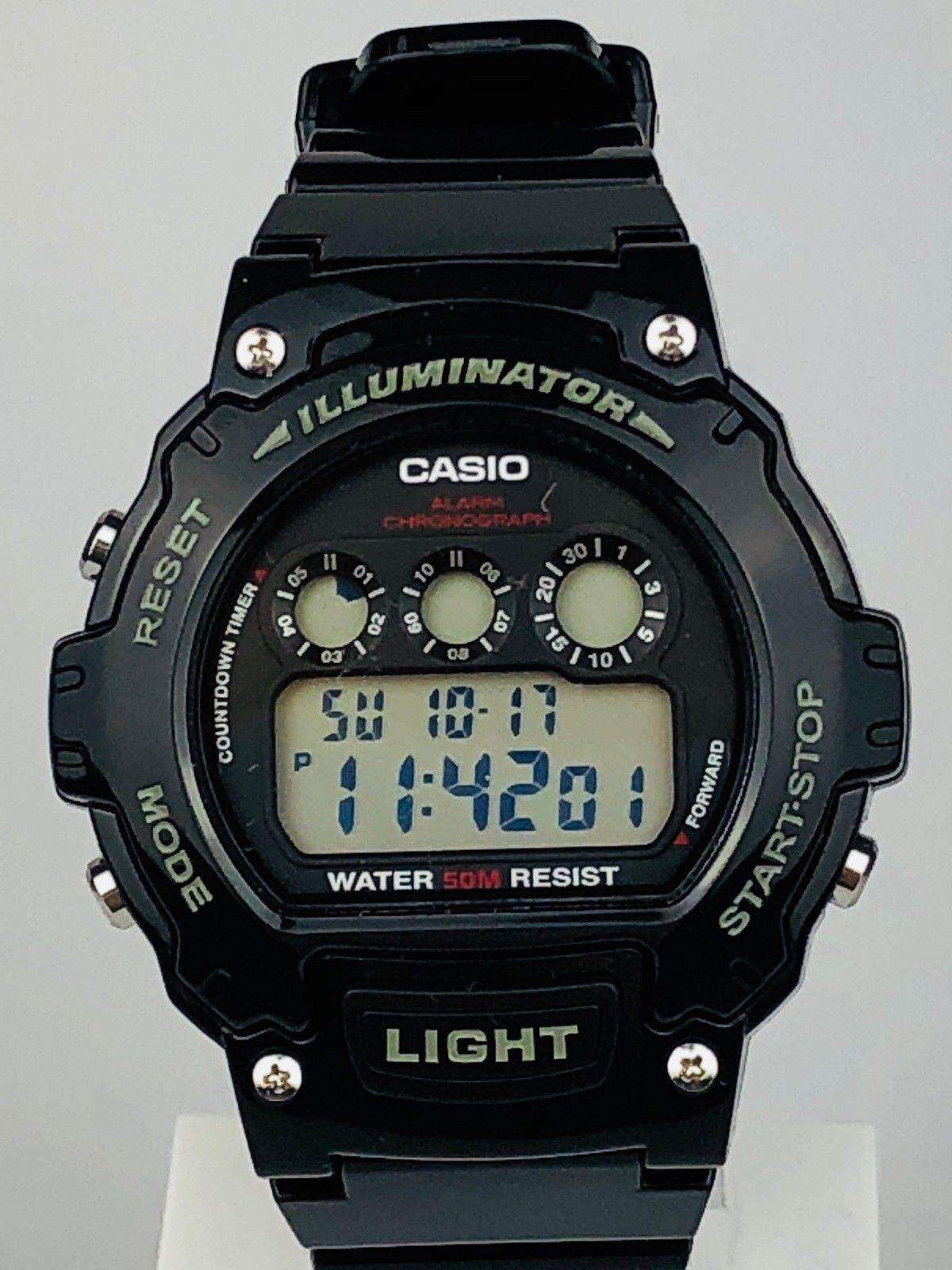 Casio men’s digital sport alarm chronograph watch face with blue digits on black LCD screen