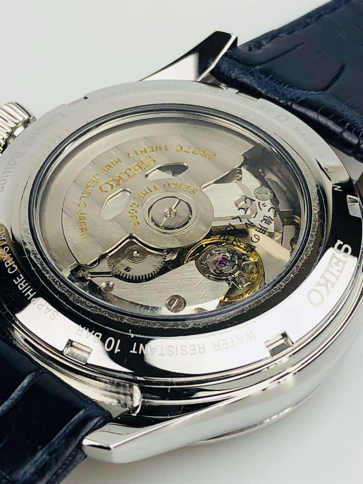 Seiko Presage automatic watch caseback in stainless steel with visible mechanical movement