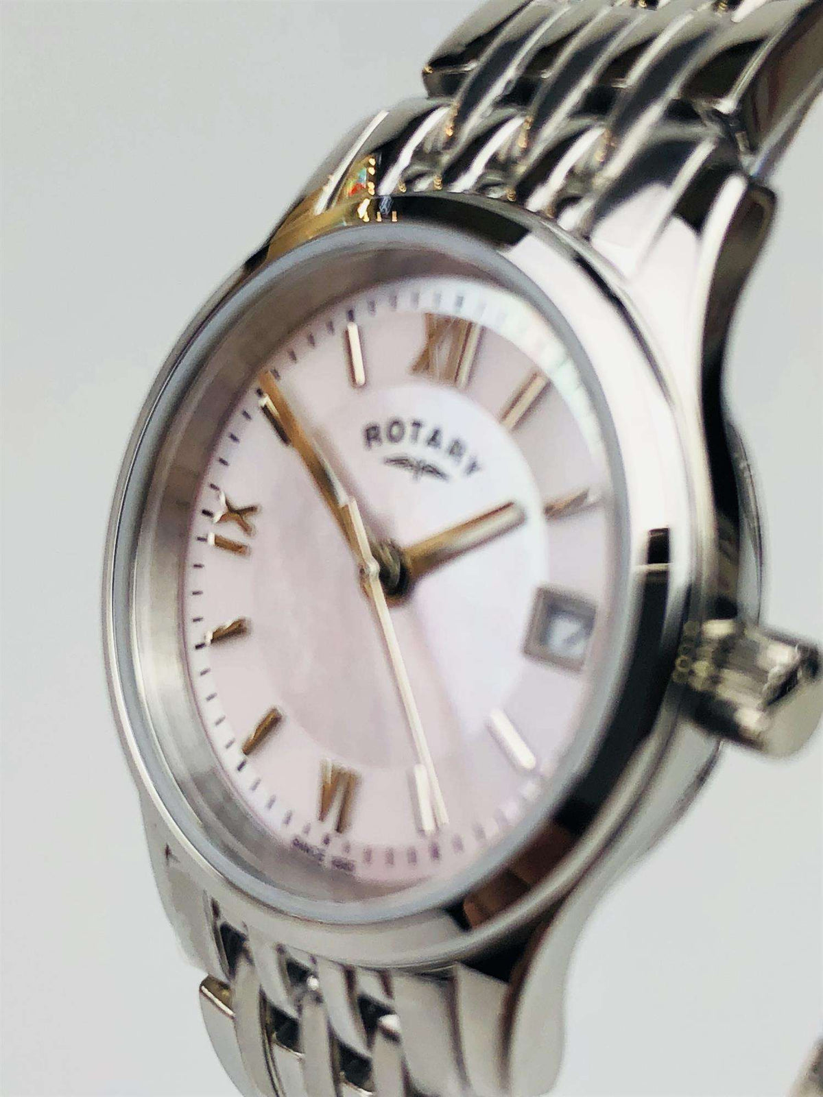 Stainless steel ladies wristwatch with mother-of-pearl dial and gold-toned hands and markers