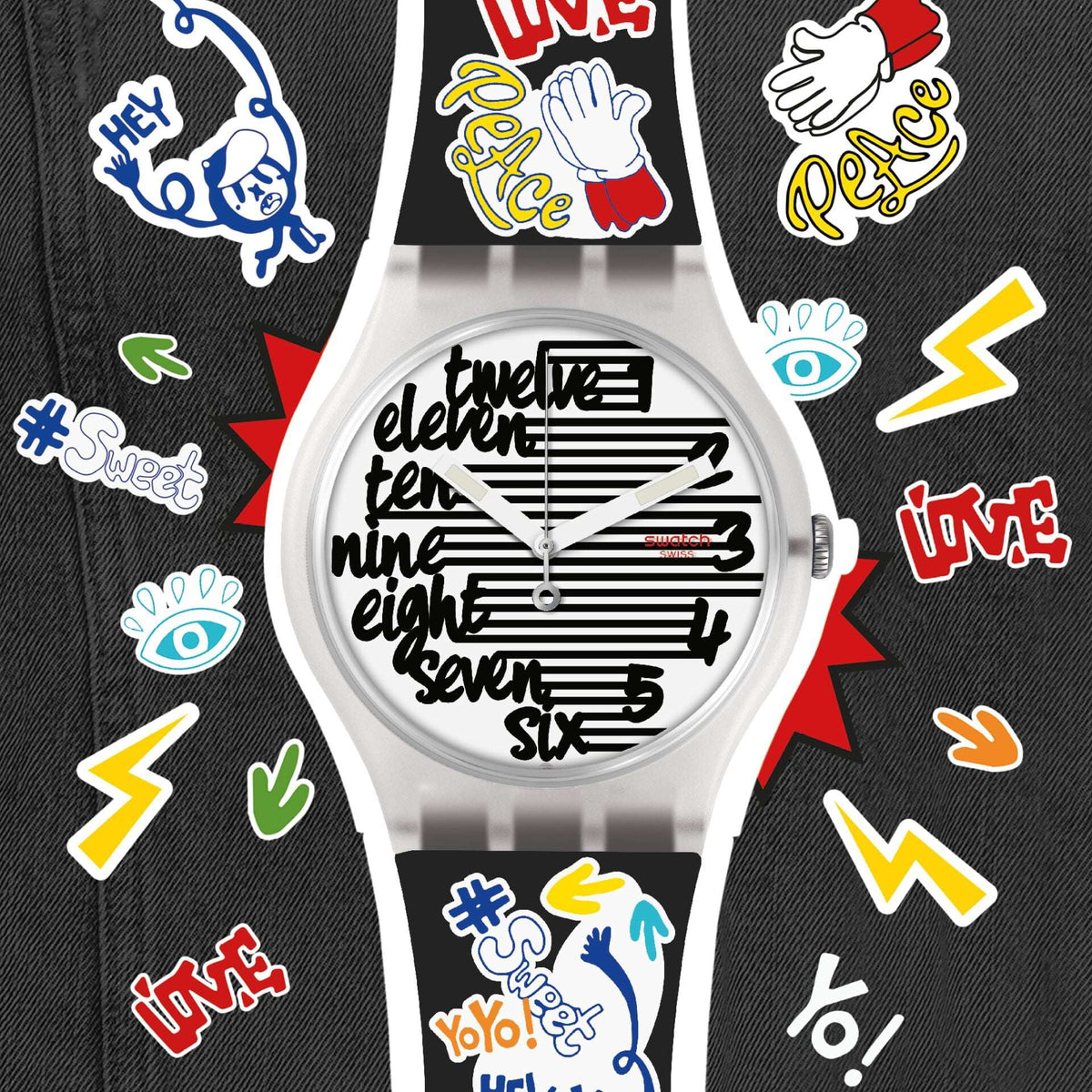 White dial watch on black silicone strap with colorful doodle icons, round plastic case