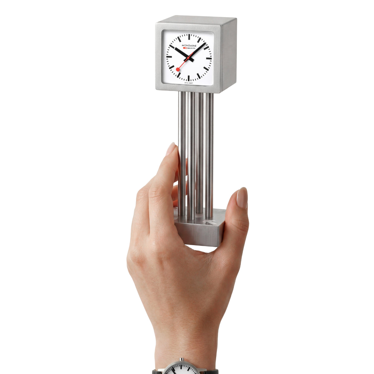 Mini table clock held from the bottom, brushed aluminum finish