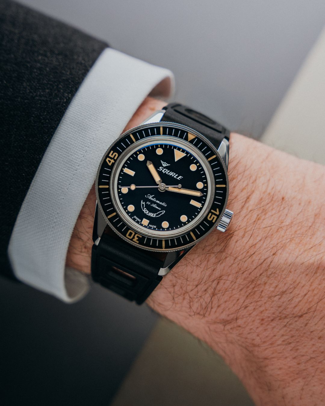 Wrist shot of Squale Sub-30 Super Squale 30 Atmos watch with black dial and black rubber strap