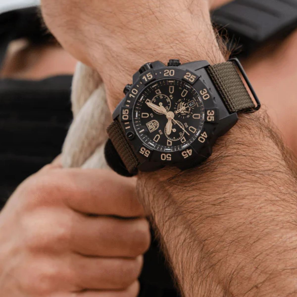 Men's black dial chronograph quartz watch with rubber strap and numbered bezel