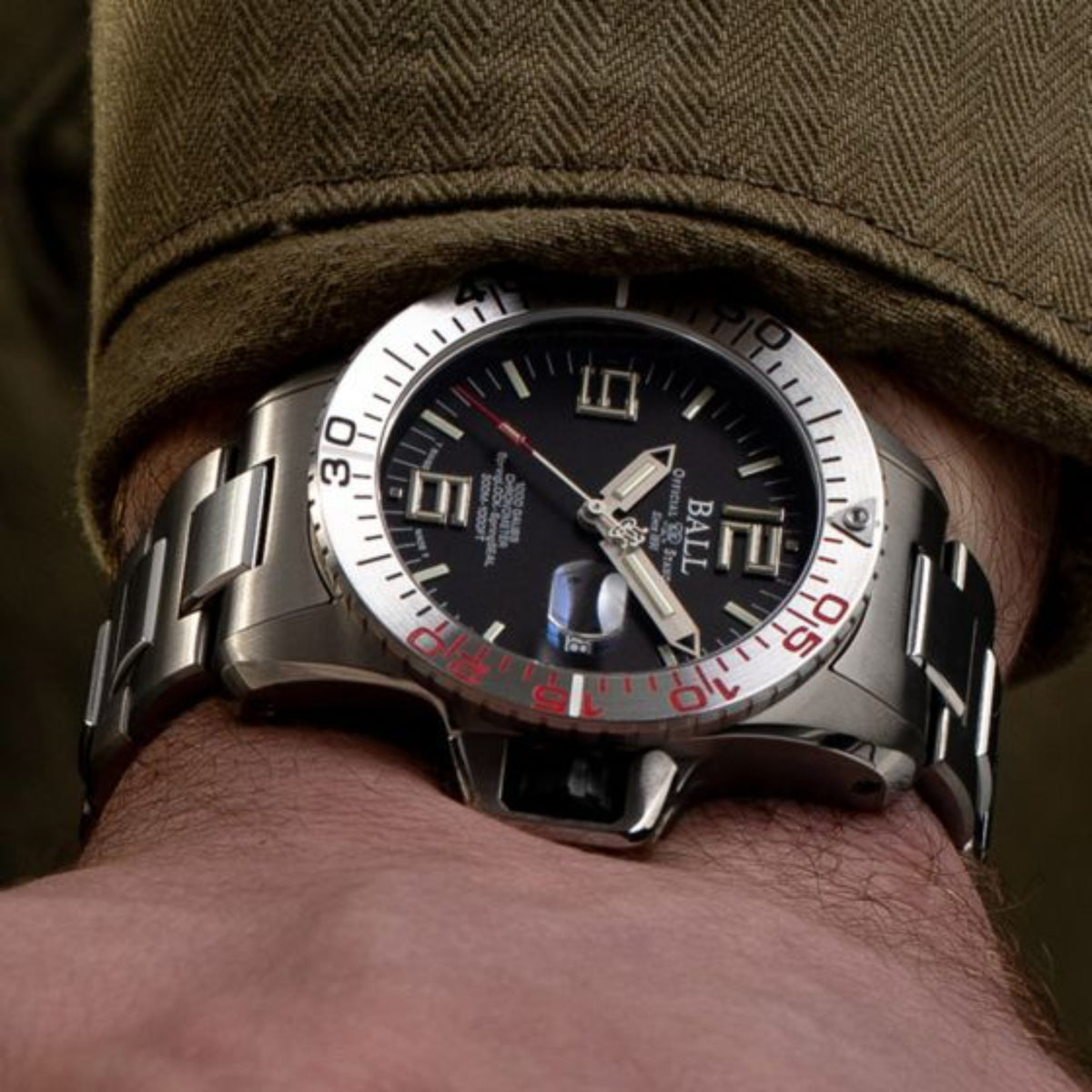 BALL Engineer Hydrocarbon EOD DM3200A-S1C-BK close-up wrist view showcasing black dial with titanium bracelet