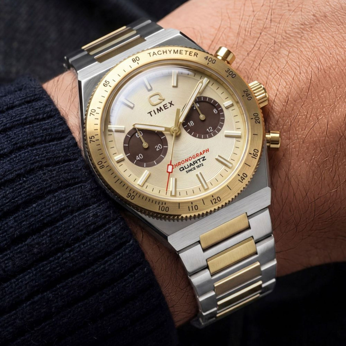 Timex Q Continental TW2Y92300 wrist view showing gold dial quartz watch styled on a person wearing a two-tone steel bracelet
