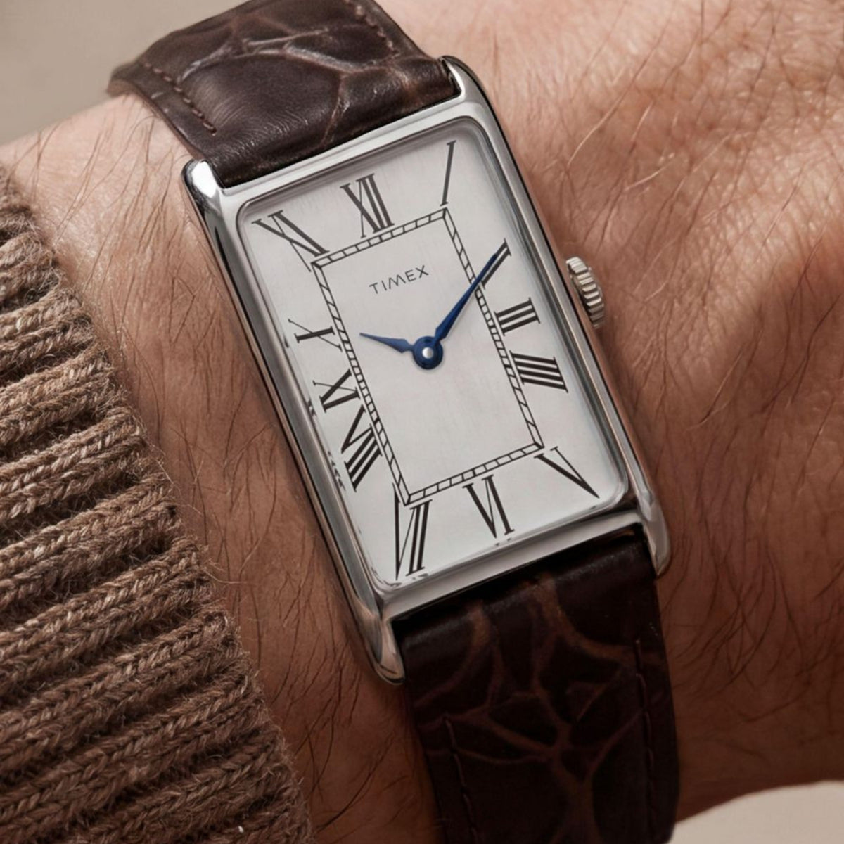 Timex Reissue 1976 Lexington TW2Y88200 wrist view showing silver dial quartz watch styled on a person wearing a leather strap