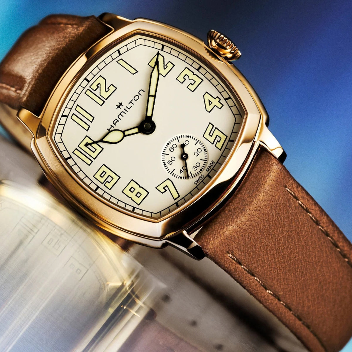 Hamilton American Classic Cushion Mechanical H36119520 detailed shot of beige dial with yellow gold-tone steel case and leather strap