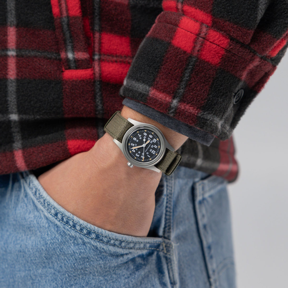 Hamilton Khaki Field H69399930 on wrist view with red plaid jacket
