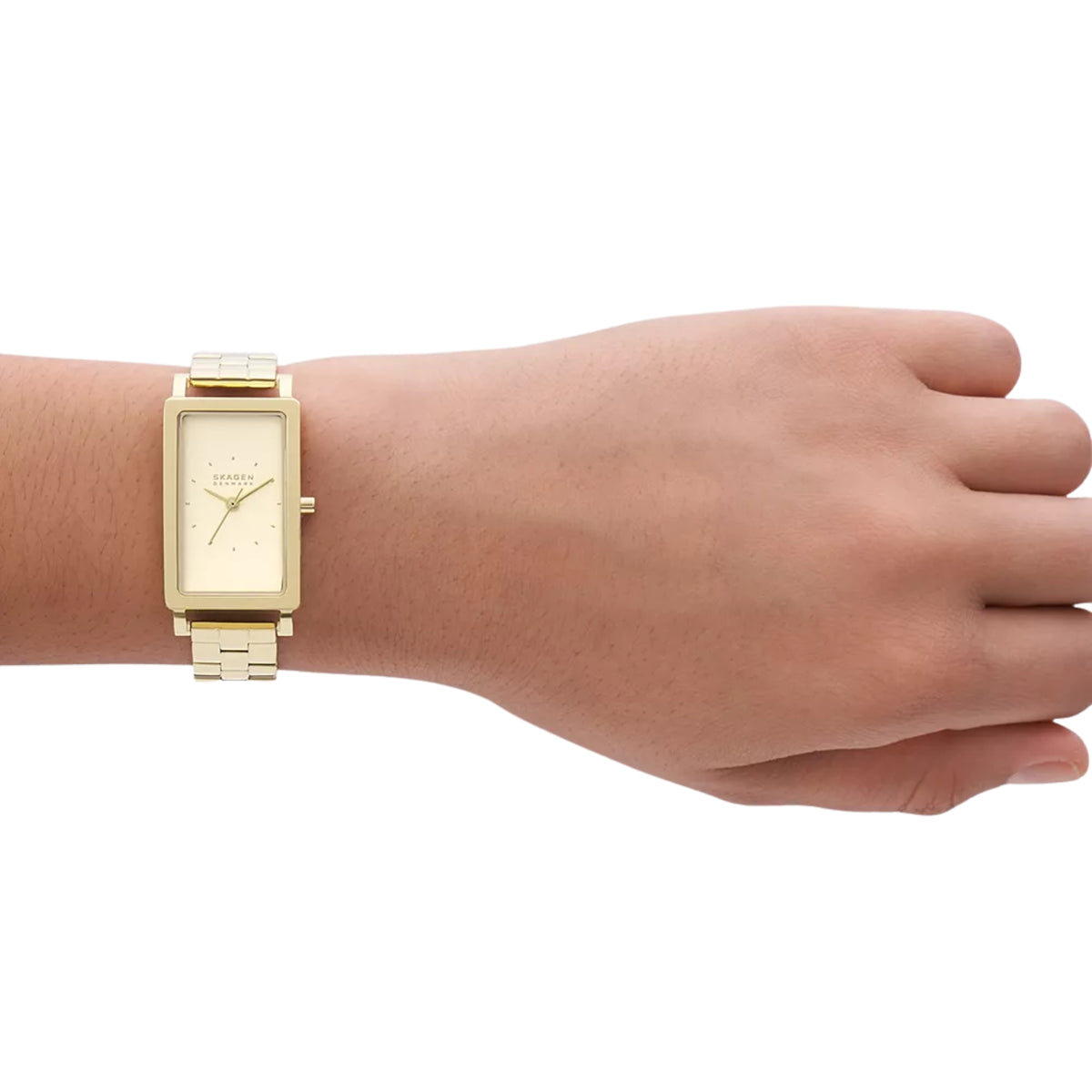 Gold-tone rectangular watch on wrist with cream dial and metal link bracelet