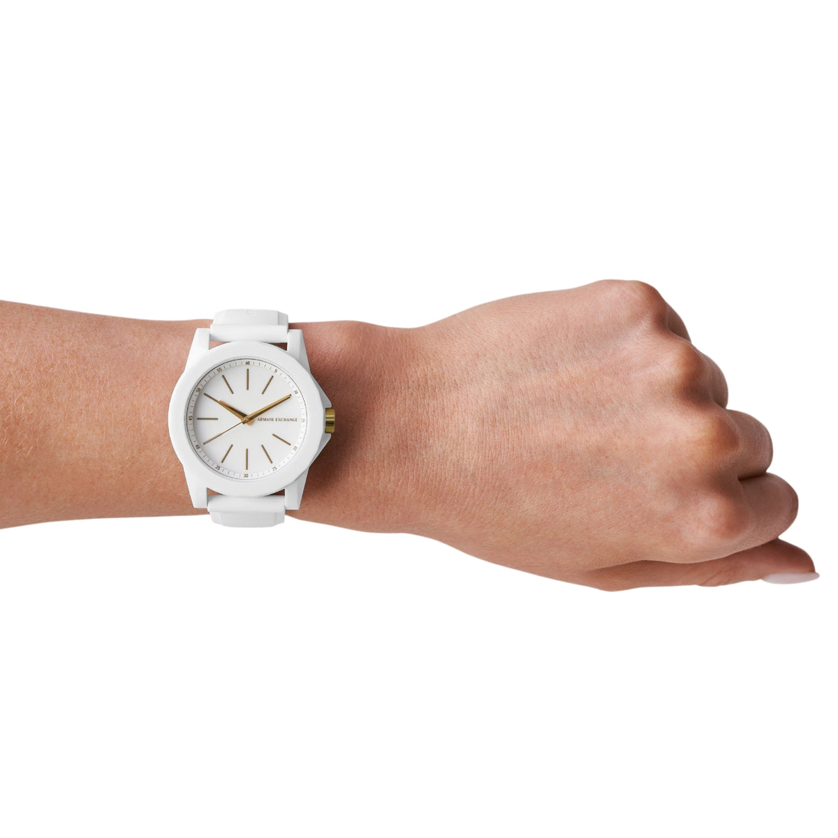 Quartz watch on wrist with white silicone band and white dial, gold accents