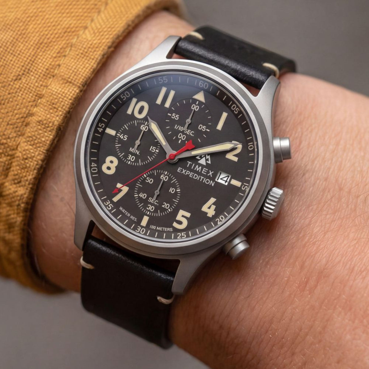 Timex Expedition Sierra TW2Y89200 wrist view showing a black dial chronograph watch styled on a person wearing a leather strap   