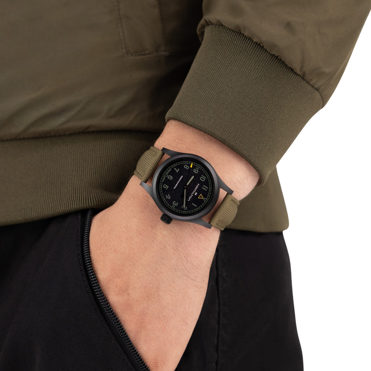 Hamilton Khaki Field Call of Duty H69469930 on-wrist shot of black dial field watch with green textile strap