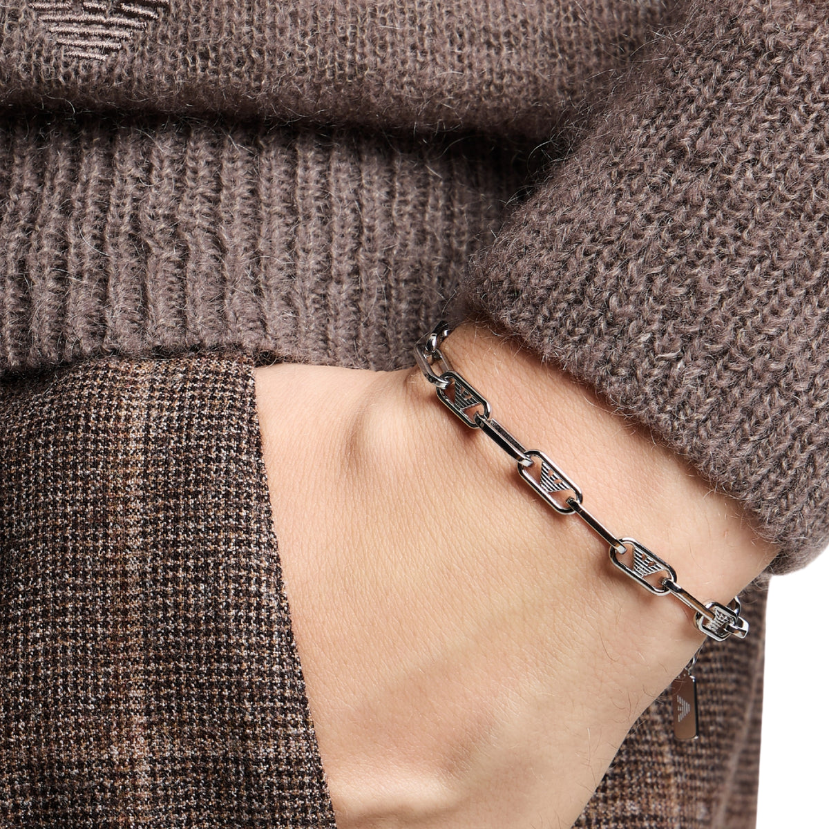 Model wearing Emporio Armani mens stainless steel link bracelet EGS3249040