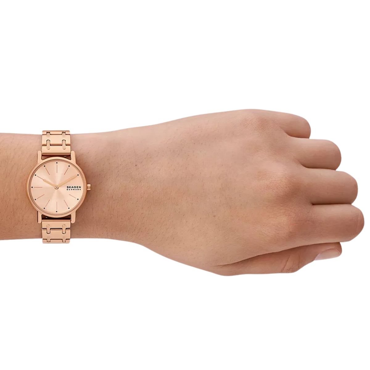 Rose gold steel ladies quartz watch on wrist, light pink dial, link bracelet