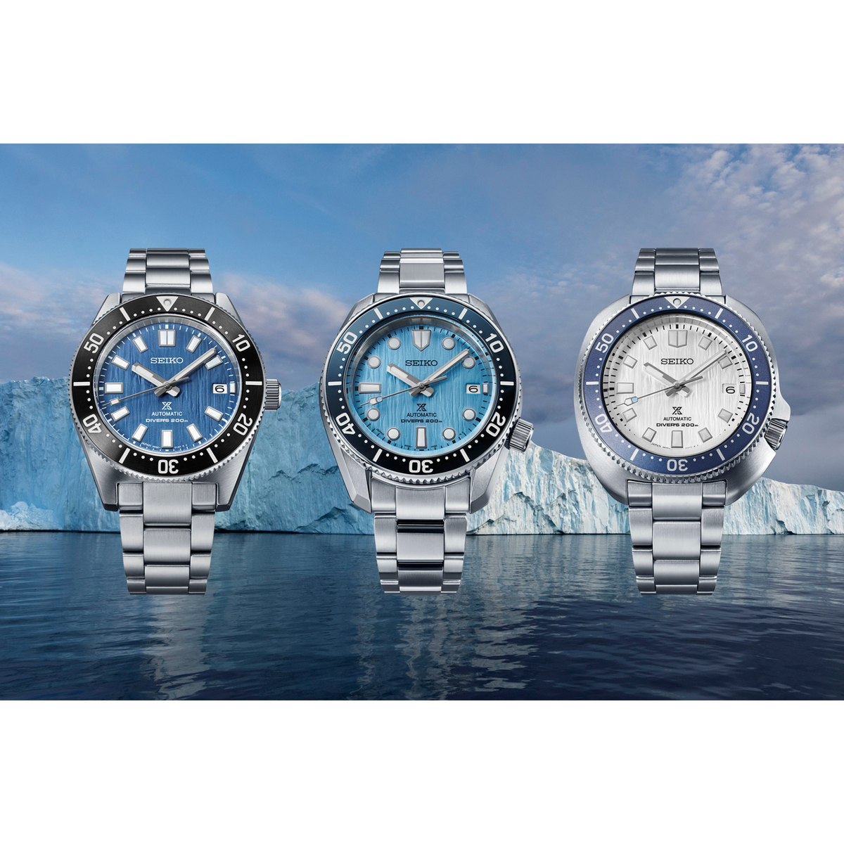 Three men's automatic dive watches with blue bezels and stainless steel bracelets.