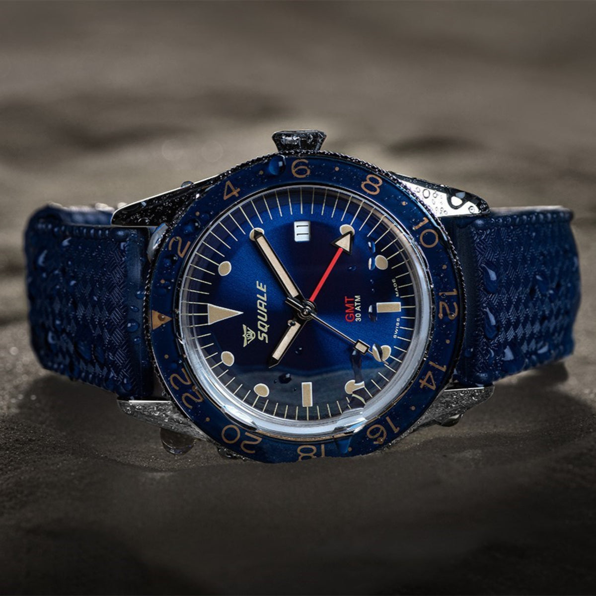 Squale Sub-30 GMT 30 ATM watch featuring deep blue dial, 24-hour bezel, and blue rubber strap