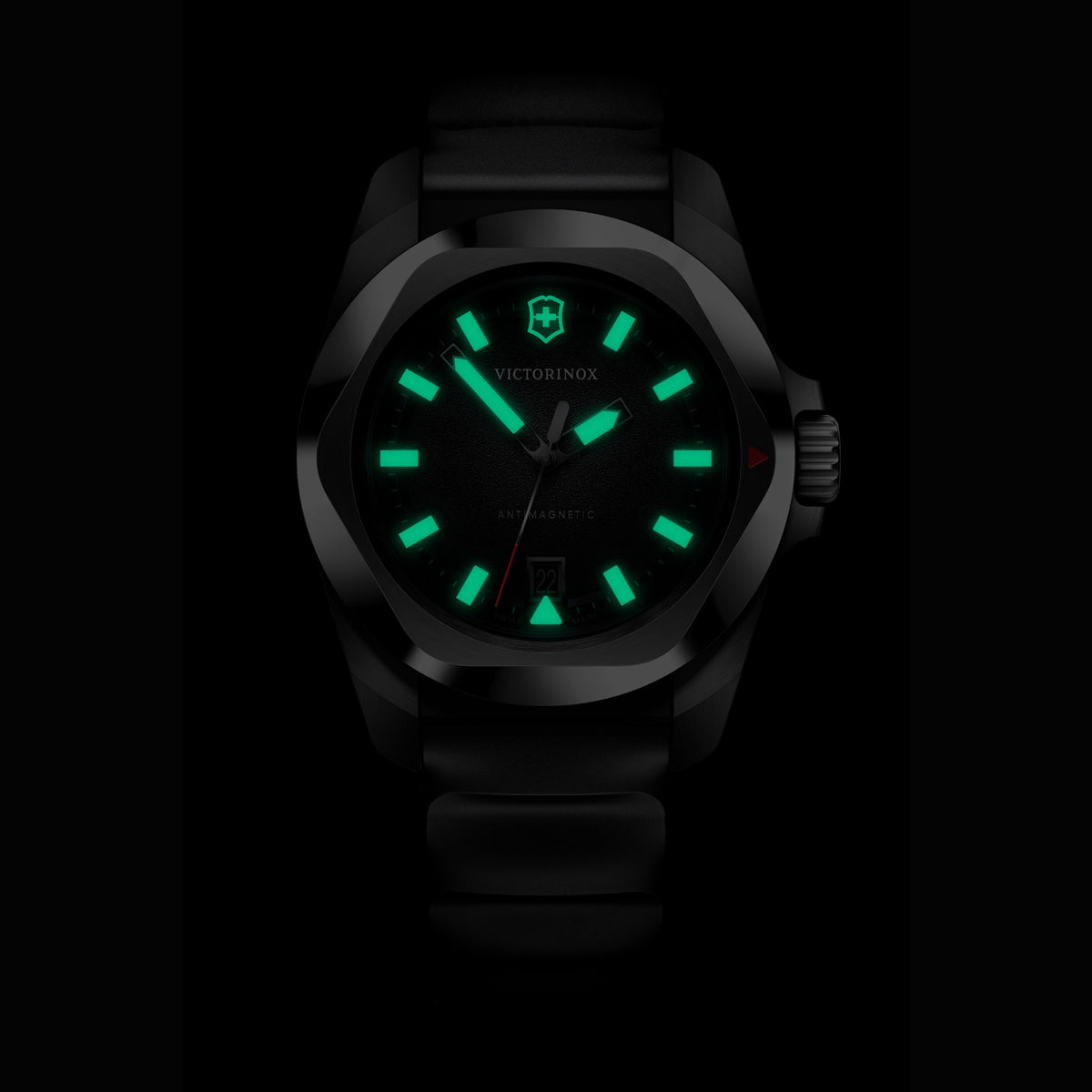 Victorinox I.N.O.X. rubber quartz 242028 watch with glowing green luminous hands and markers in dark setting