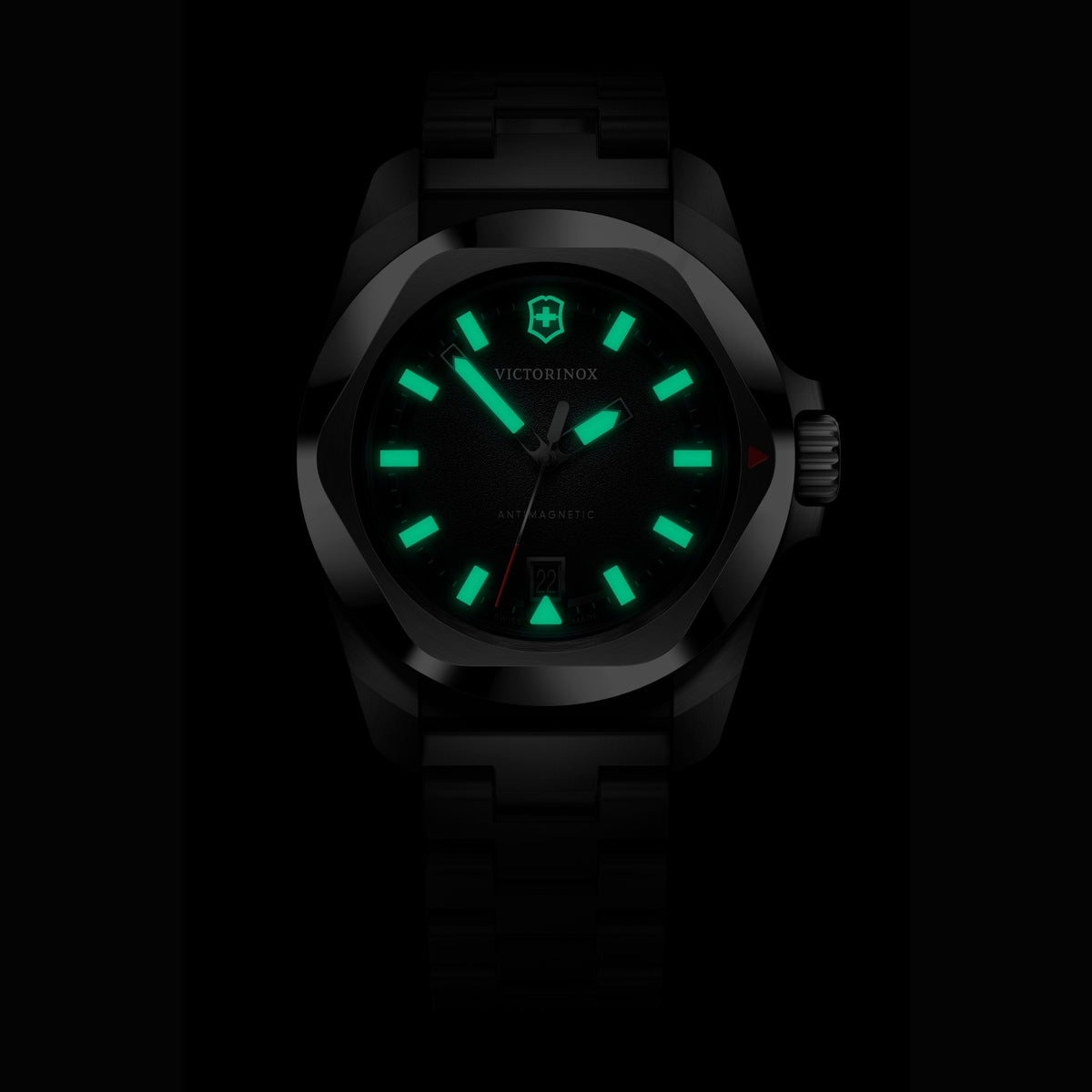 Front view of a Victorinox I.N.O.X. 41mm 242030 watch highlighting bright green luminous hands