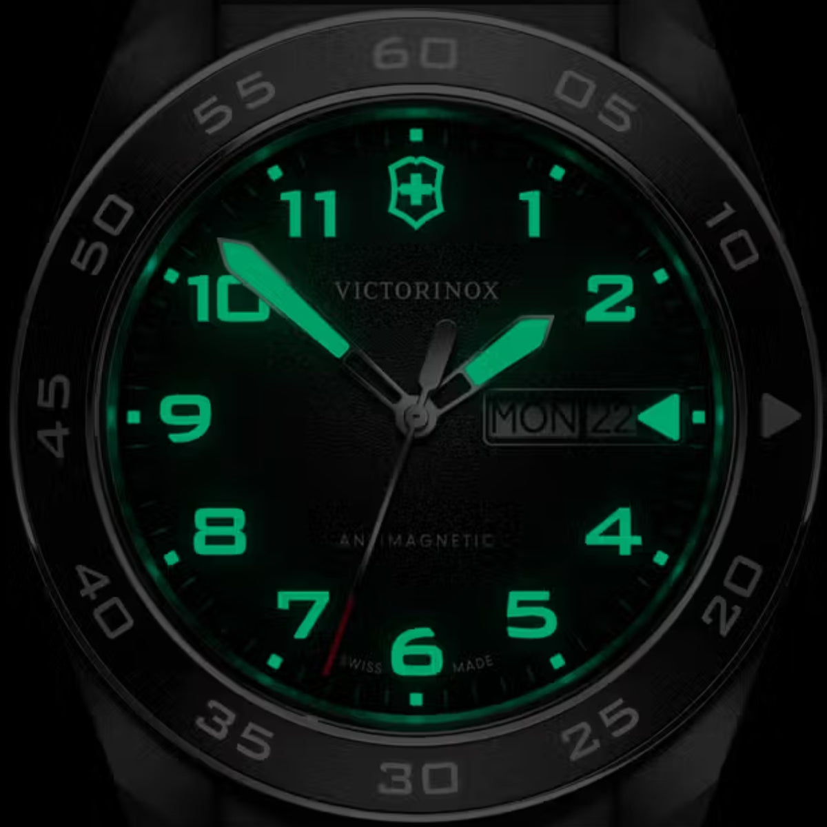 Victorinox Swiss Army quartz watch, black dial with green luminous numerals and steel case