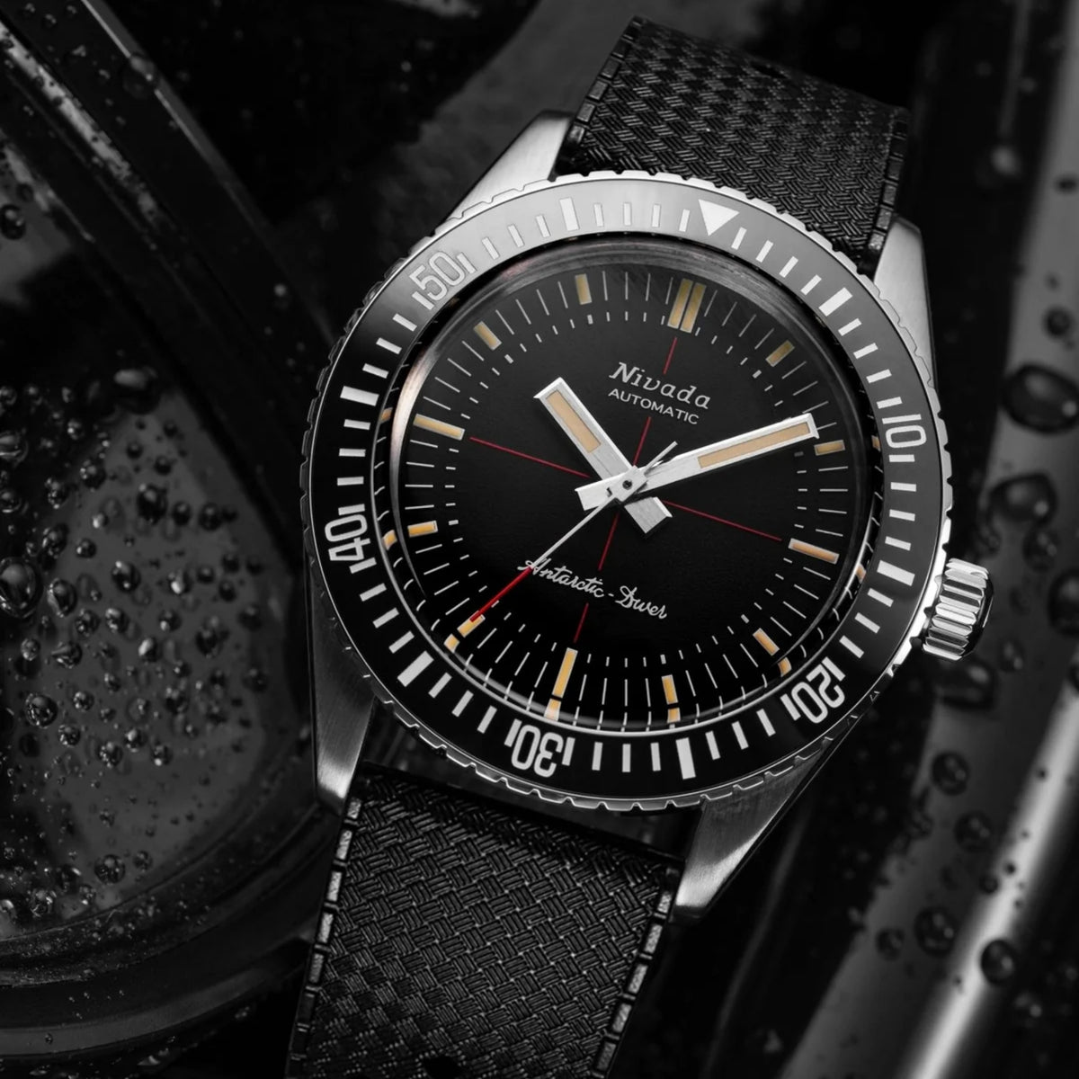 Black rubber strap diver watch with textured bezel, crosshair dial, and minute track