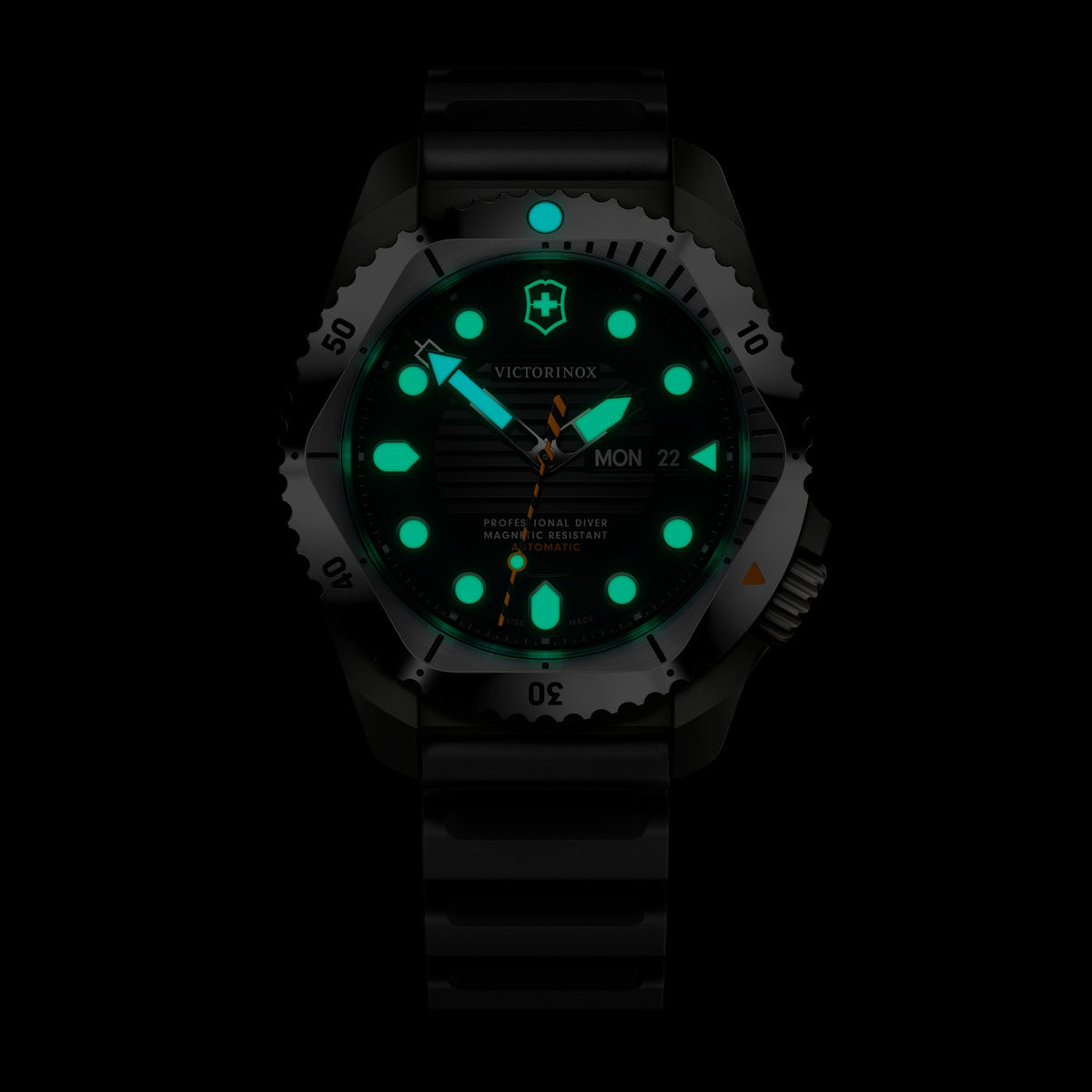 Men's automatic diving watch with glowing green markers on black dial and black rubber strap