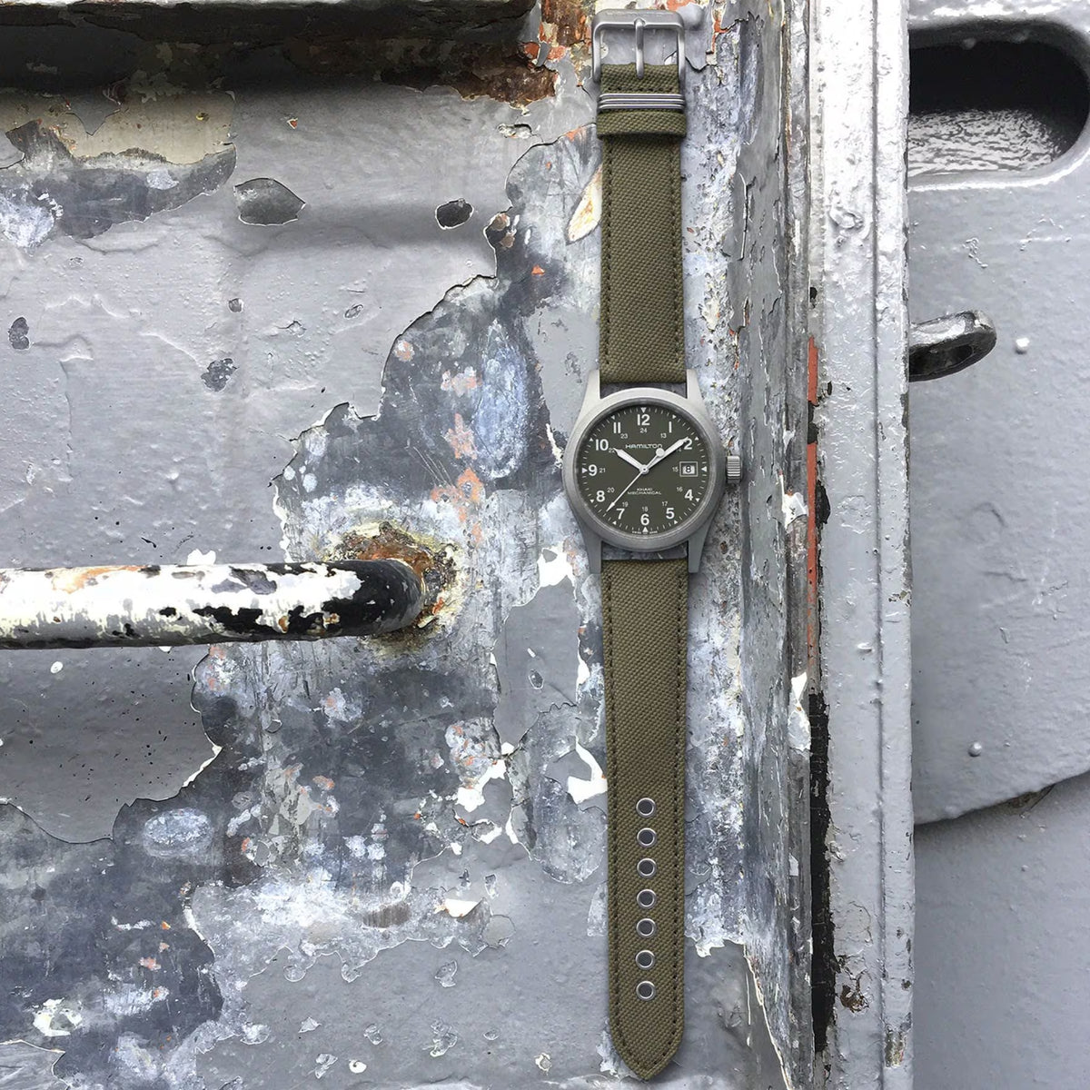 Hamilton Khaki Field 38mm H69439363 Mechanical watch with a green dial and green canvas strap.