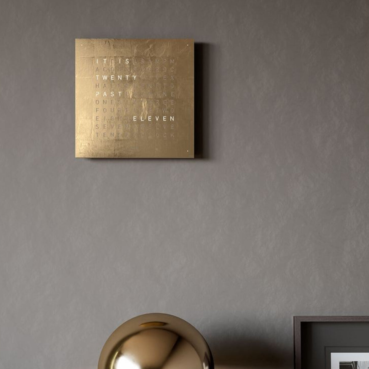 Gold English wall clock panel with illuminated words on a square face