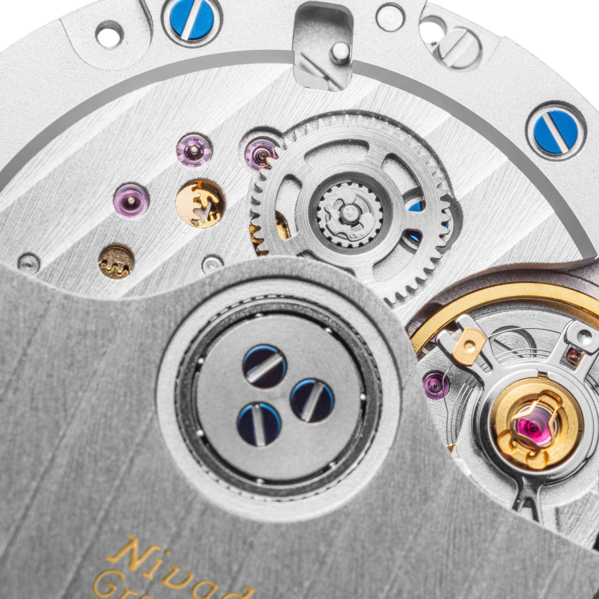 Nivada Grenchen F77 MK2 68062A77-DR macro shot highlighting movement gears, jewels, and balance wheel