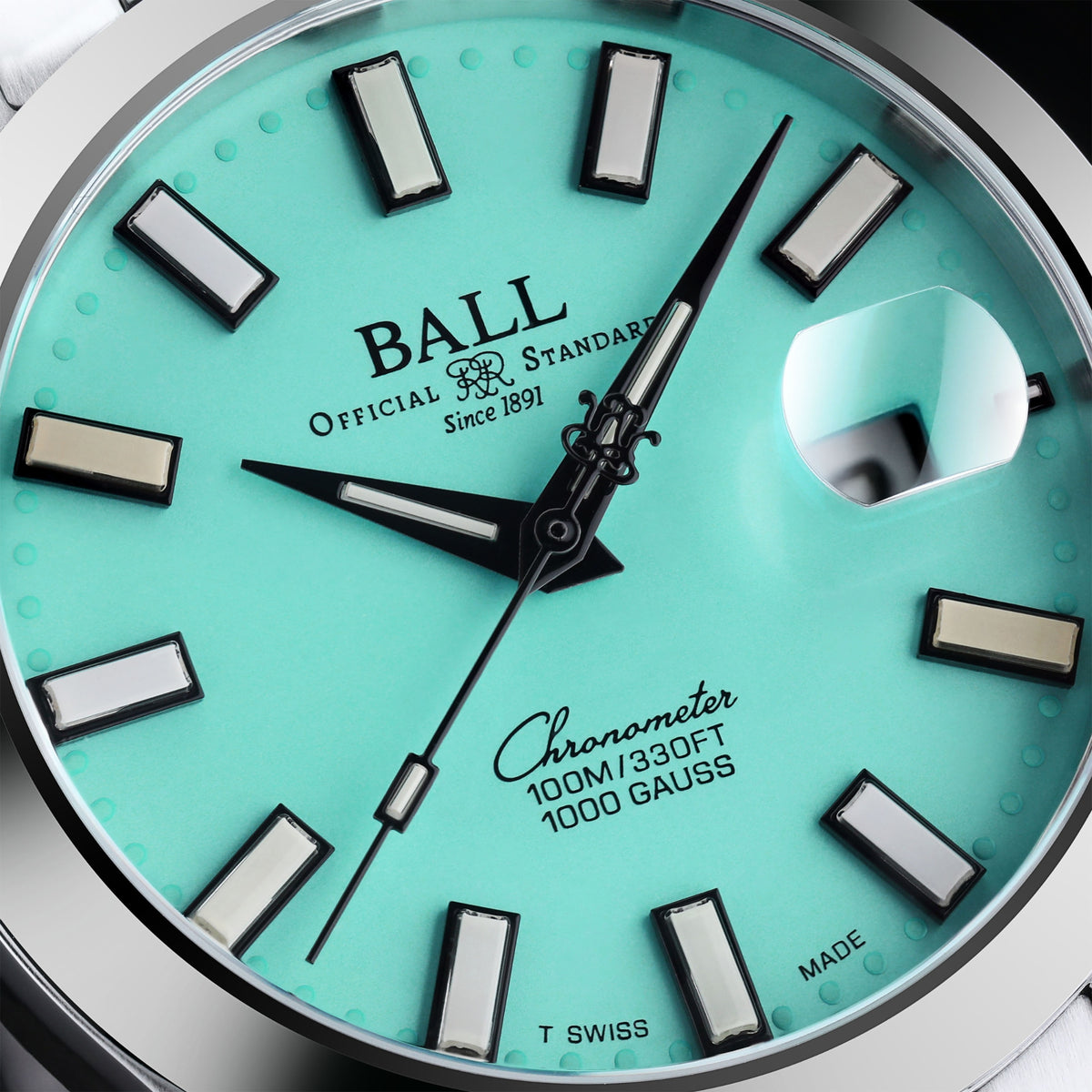 Turquoise dial men’s automatic watch with baton hour markers, black hands, silver bezel