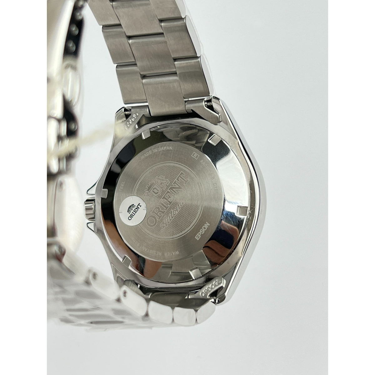 Stainless automatic diver watch caseback with engraved back, on steel bracelet links