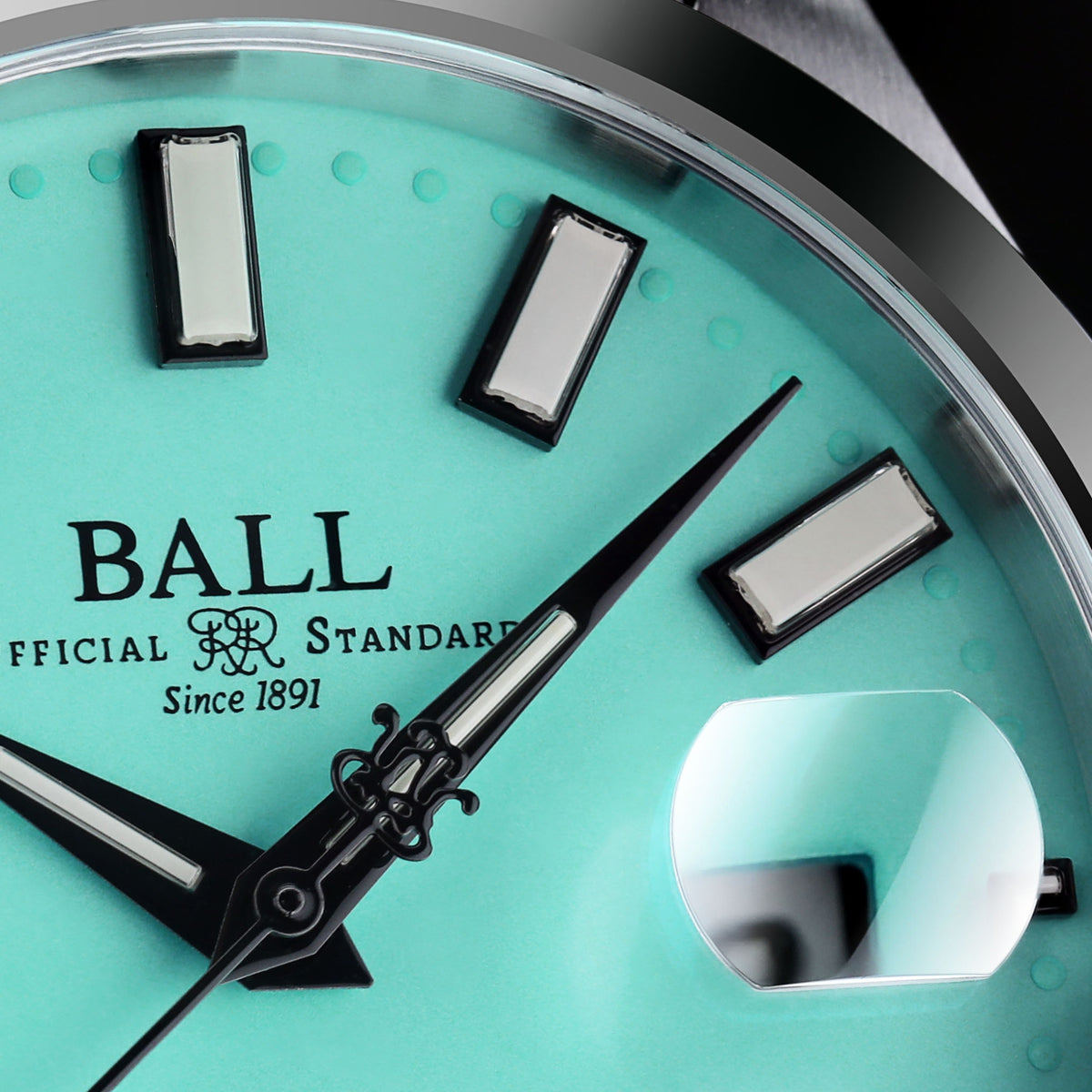 Turquoise dial watch with metal indices, BALL branding, black hands, clear window