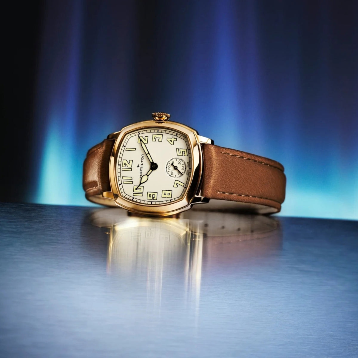 Hamilton American Classic Cushion Mechanical H36119520 studio view showing beige dial watch on reflective surface