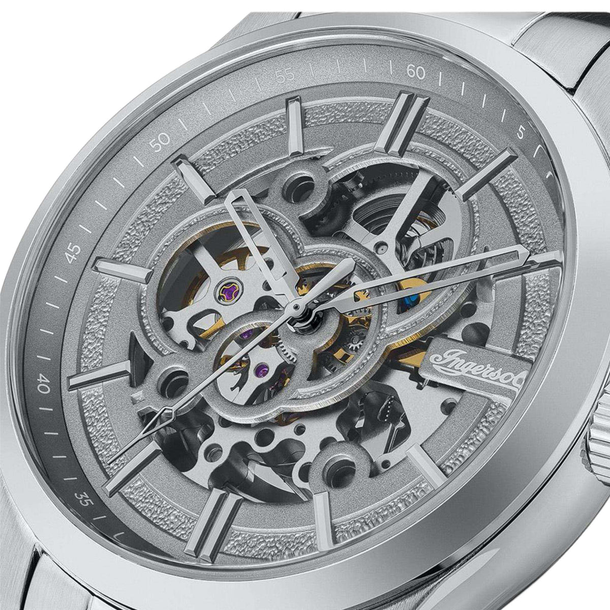 Stainless steel automatic movement close-up with grey textured dial ring and hands