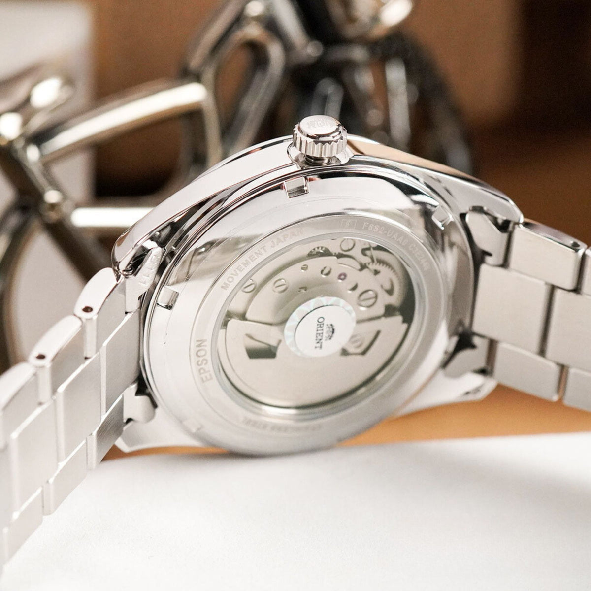 Close-up of the exhibition caseback displaying the internal automatic movement gears of the Orient Semi Skeleton mens automatic watch