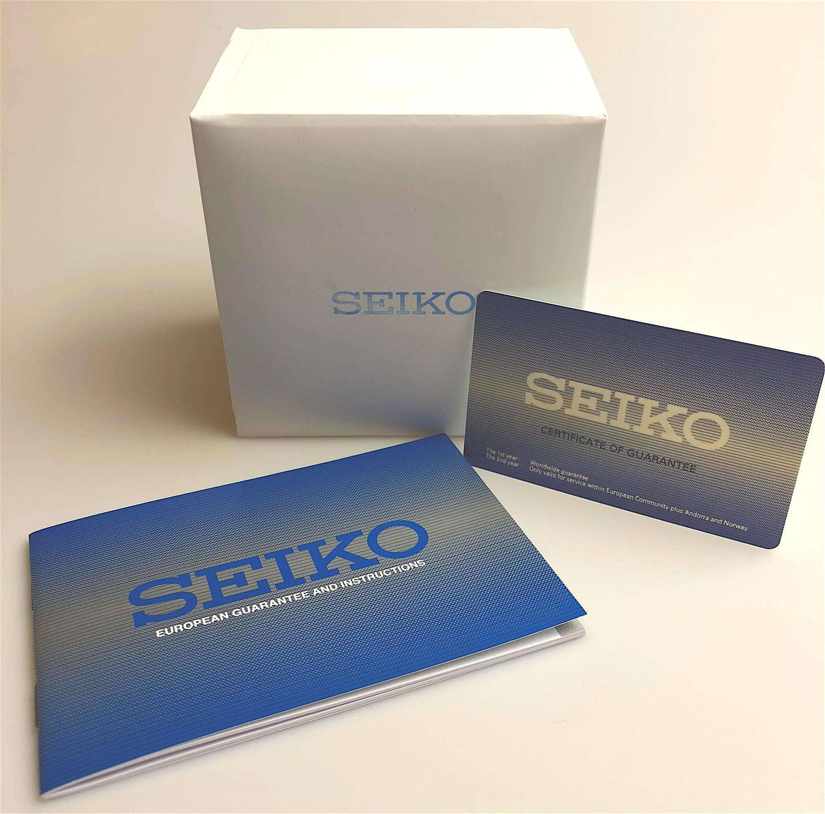 Seiko watch packaging box with blue warranty and instruction cards