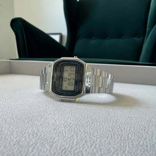 Casio A164WA-1VES steel digital quartz watch with LCD display on white cushion
