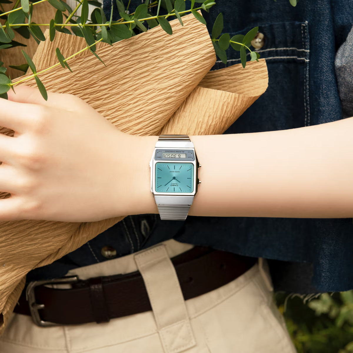 Casio Vintage Edgy AQ-800EC-2AE lifestyle view on a wrist holding a paper bouquet