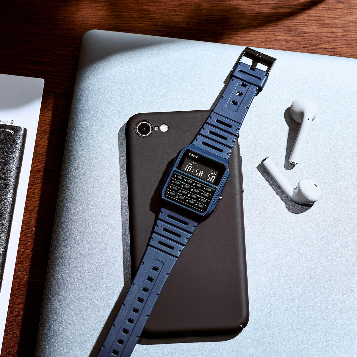 Blue resin strap digital watch with black display, angled close-up view