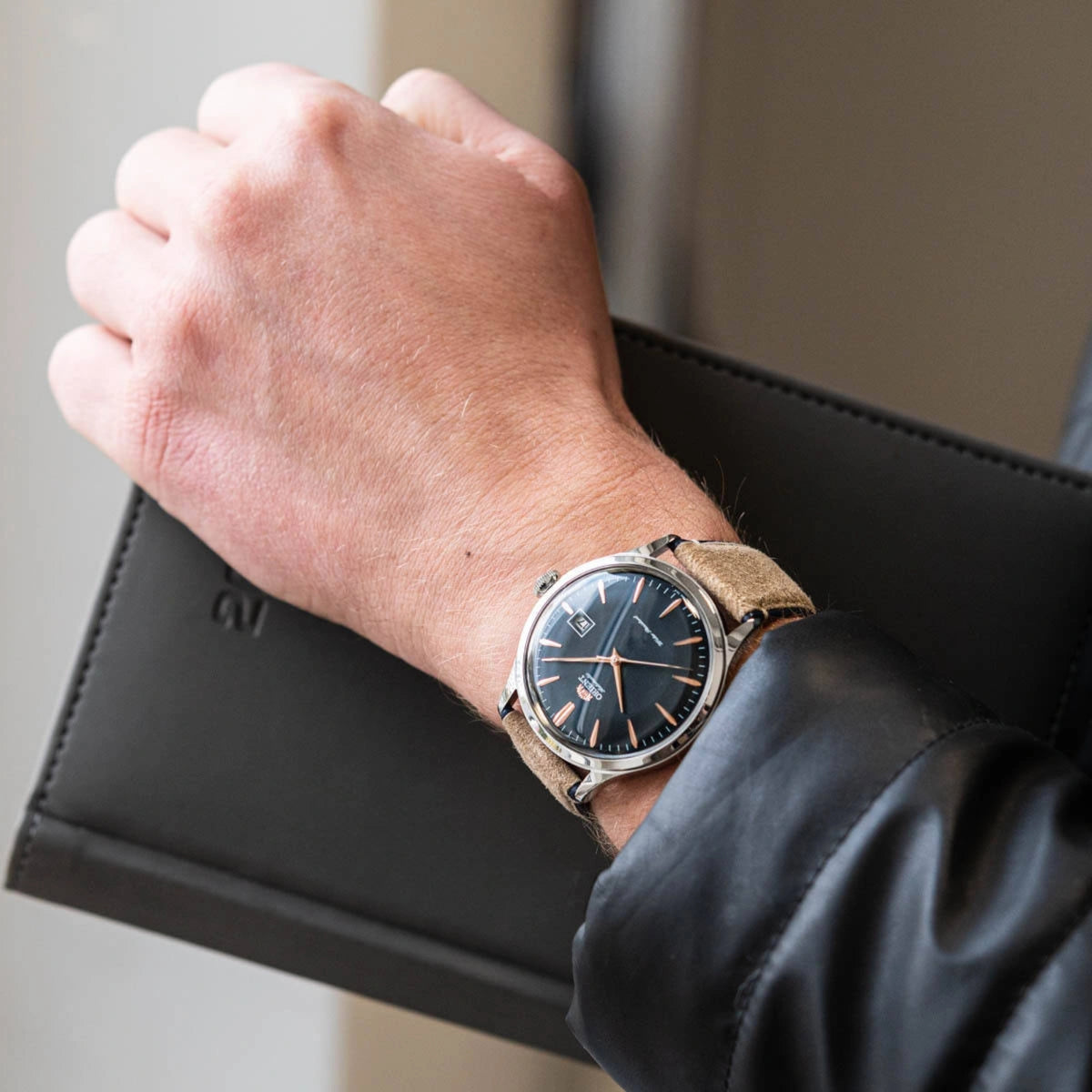 Men's Orient automatic watch on wrist, dark blue dial with tan leather strap