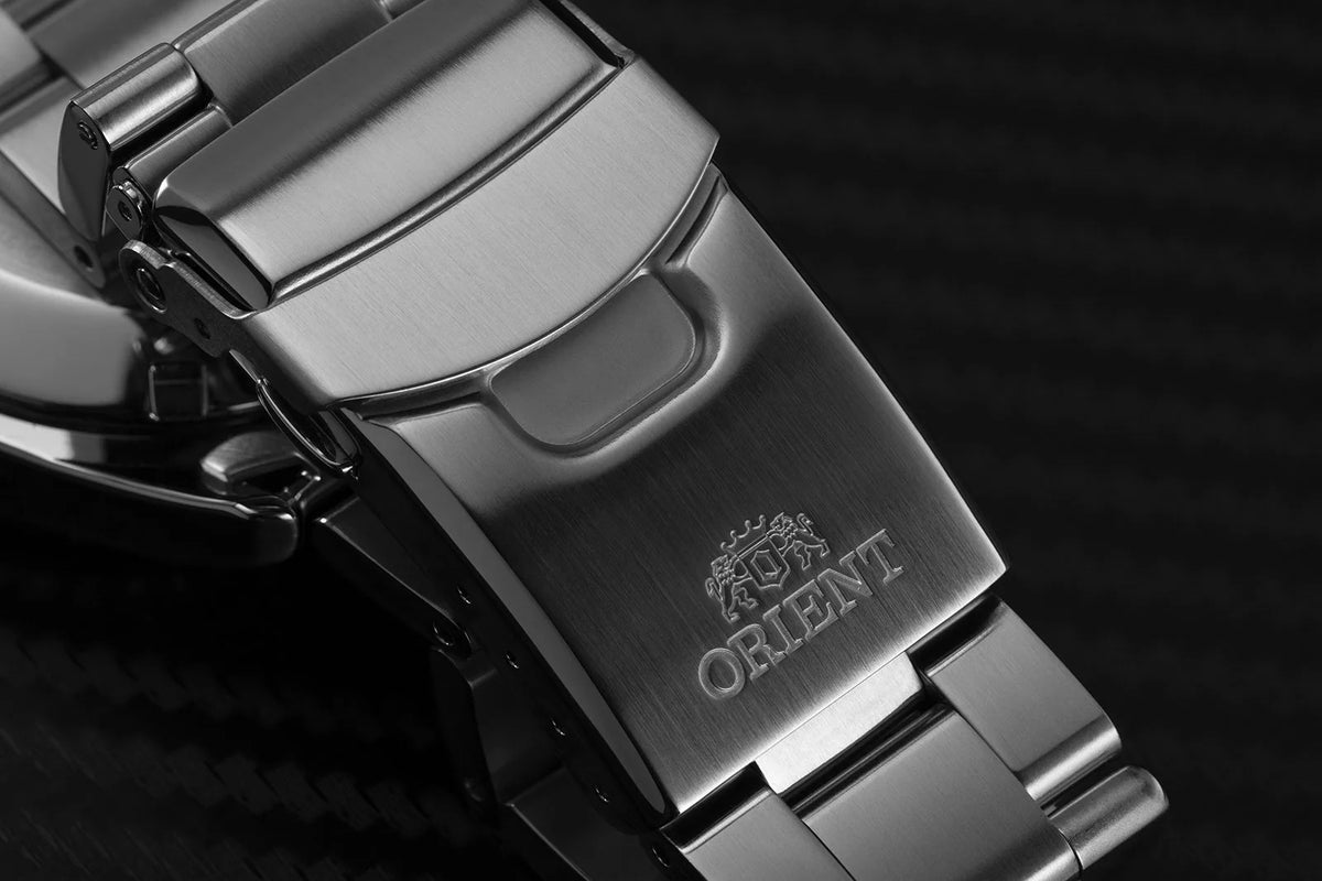 Steel bracelet clasp with ORIENT engraving on automatic watch