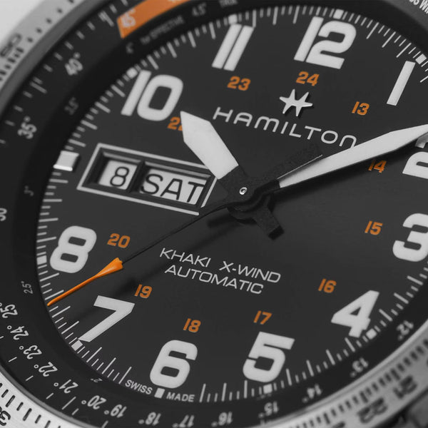 Hamilton Khaki Aviation H77755133 black dial with oversized luminous numerals and day-date display close-up