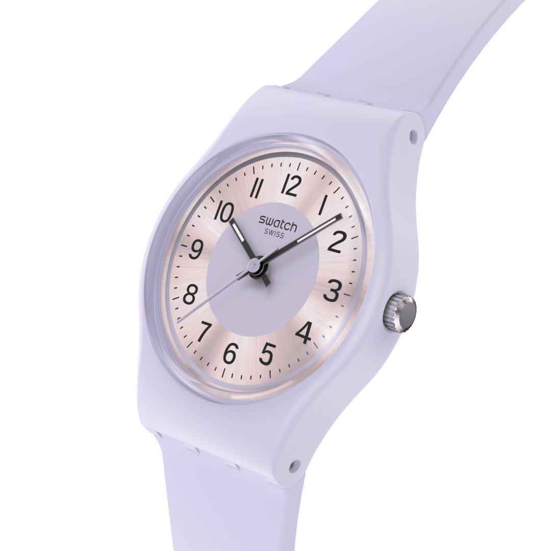 Lilac silicone strap watch close-up, round pale dial with Swatch Swiss