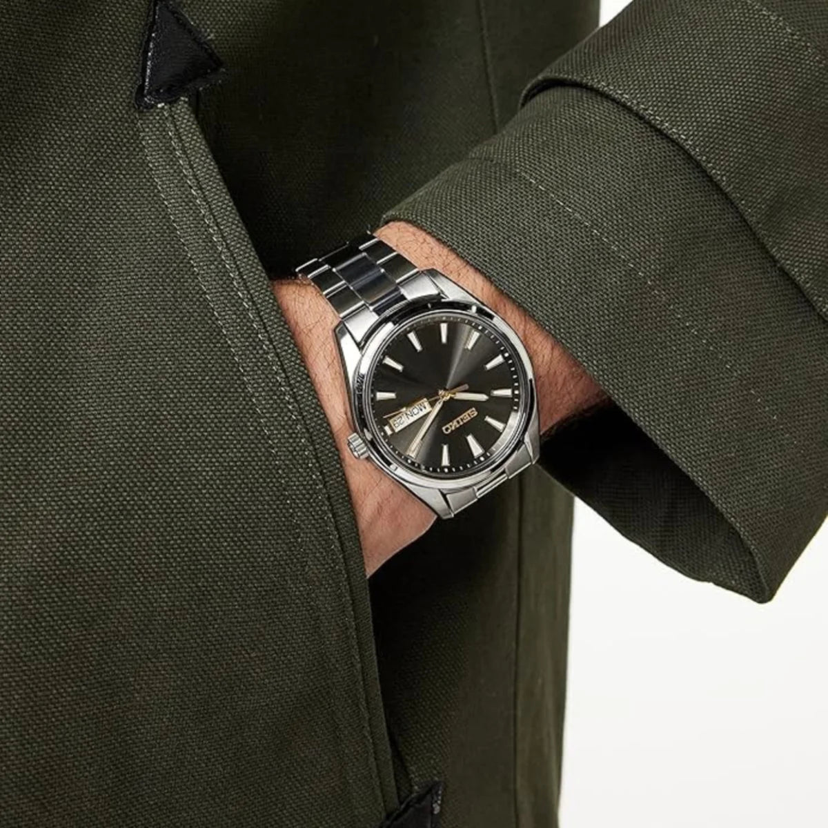 Seiko Essentials Quartz grey sunburst dial and steel bracelet watch on wrist