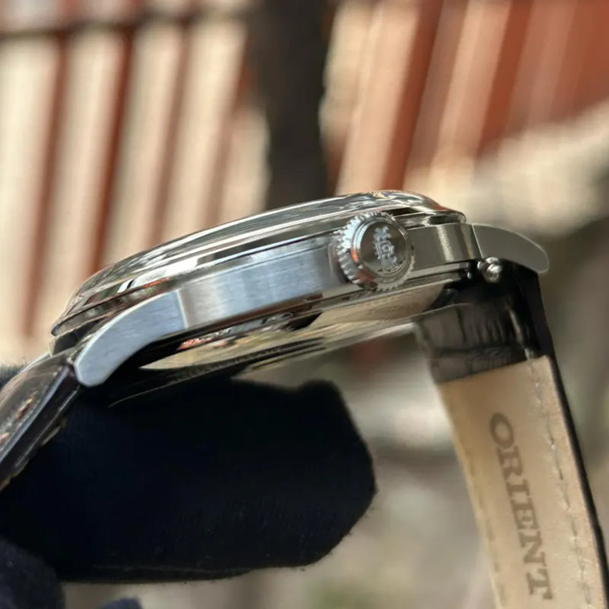 Orient Bambino RA-AC0026R30B stainless steel case and domed crystal side profile 