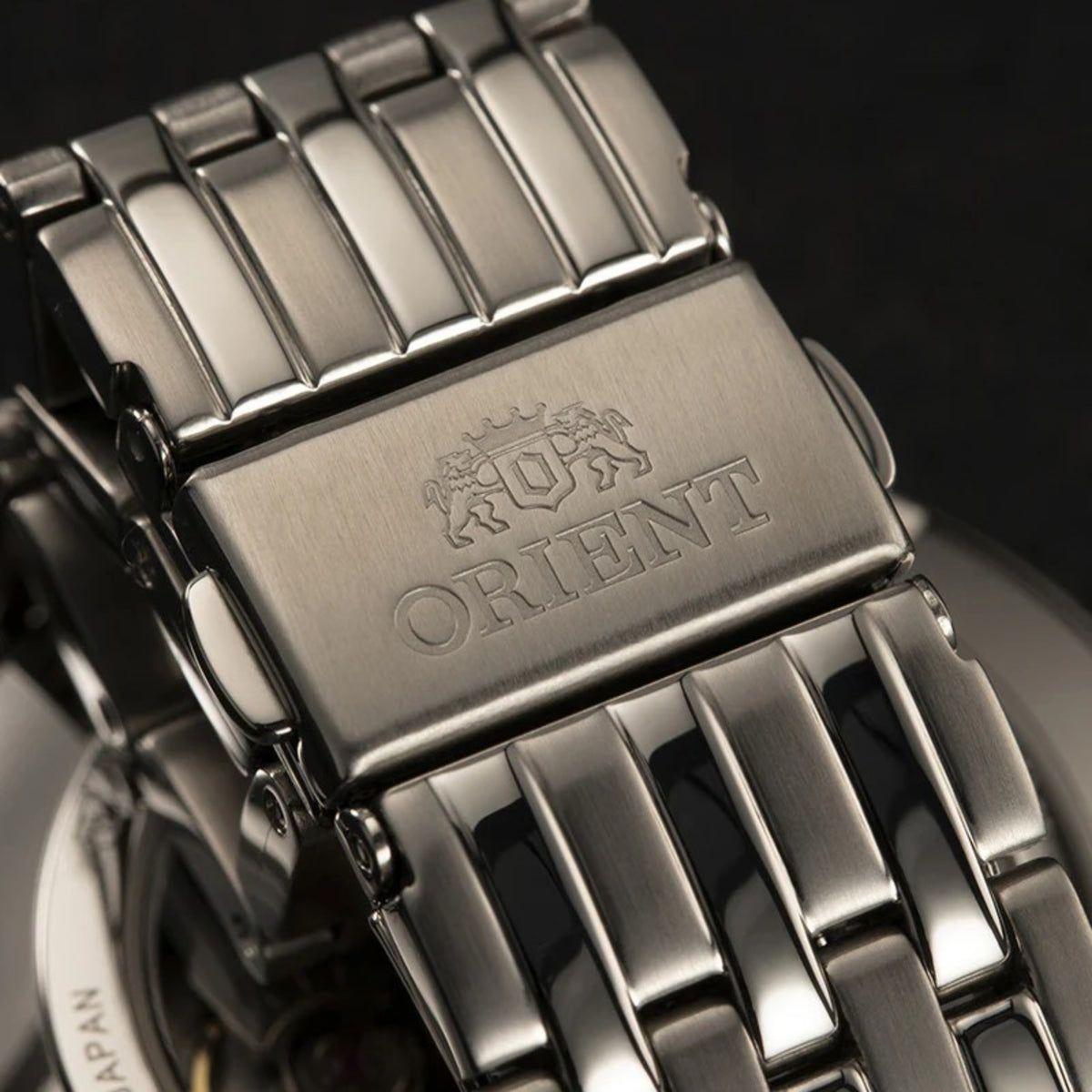 Stainless steel watch bracelet clasp with raised Orient branding