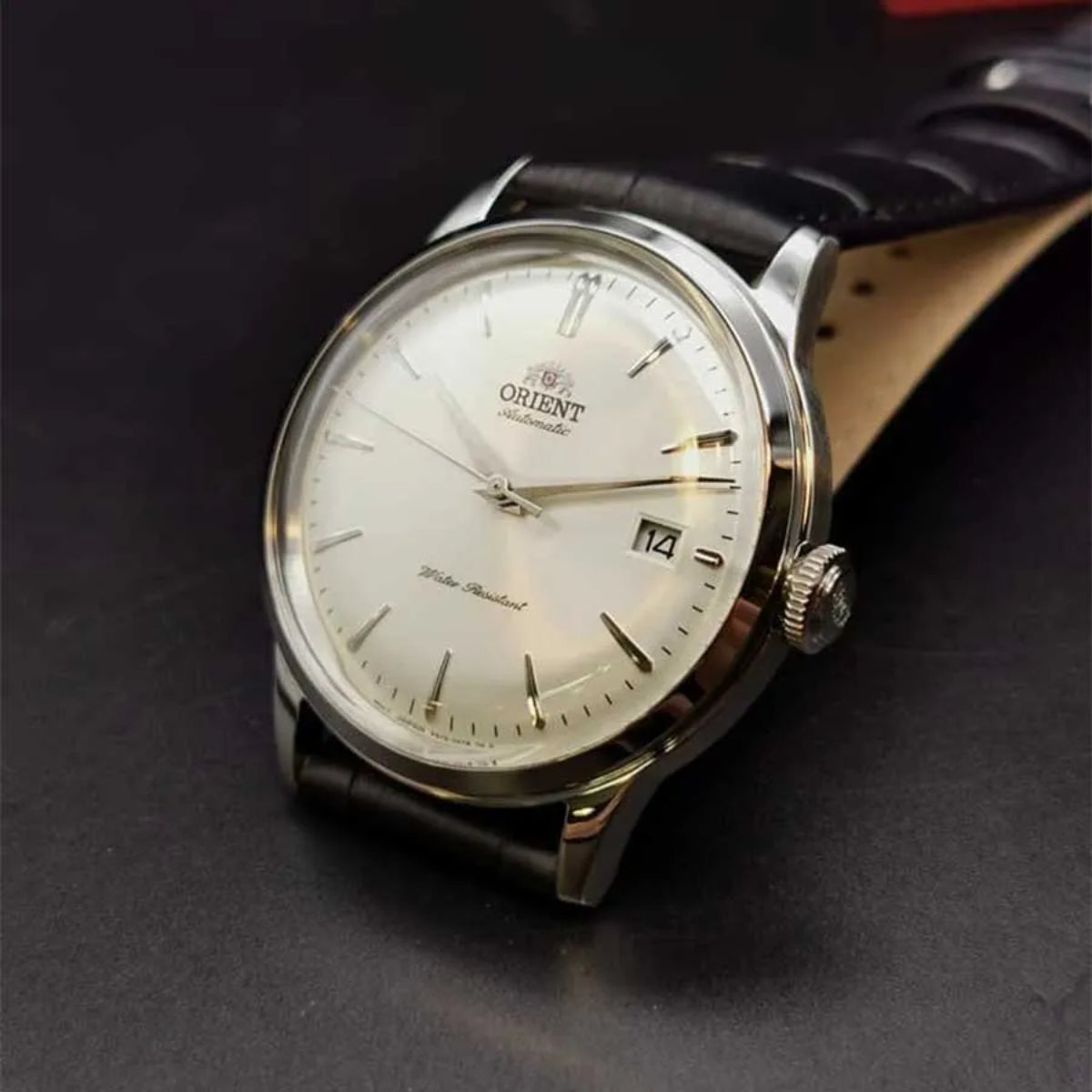 Orient Bambino RA-AC0M03S30B watch with white dial and black leather strap, silver-tone stainless steel bezel and crown