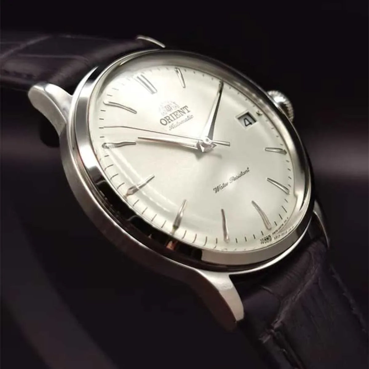 Orient Bambino automatic wrist watch AC0M03S30B with white dial and black leather strap, silver case, and date marker