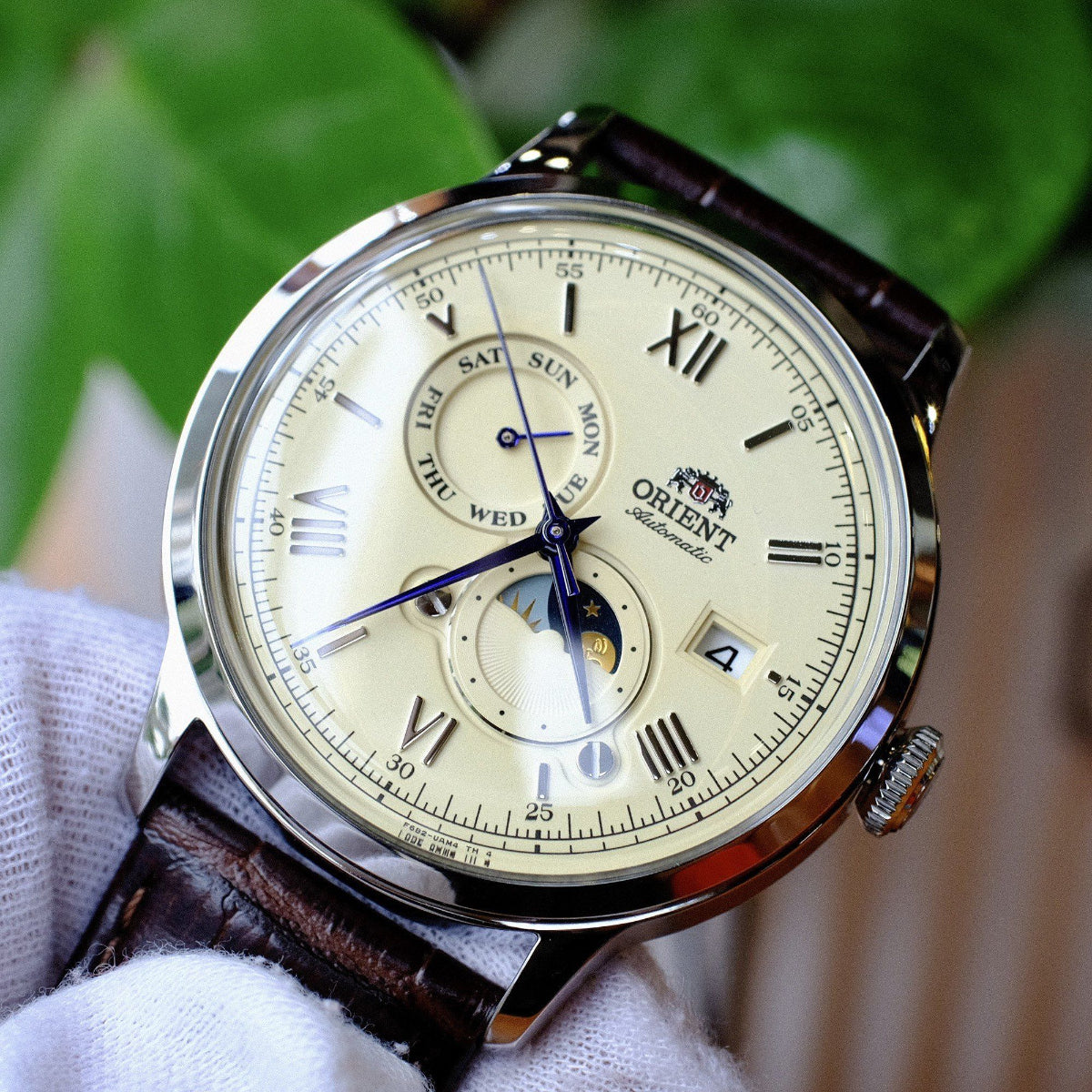 Orient Automatic Sun and Moon cream dial and blue hands detail