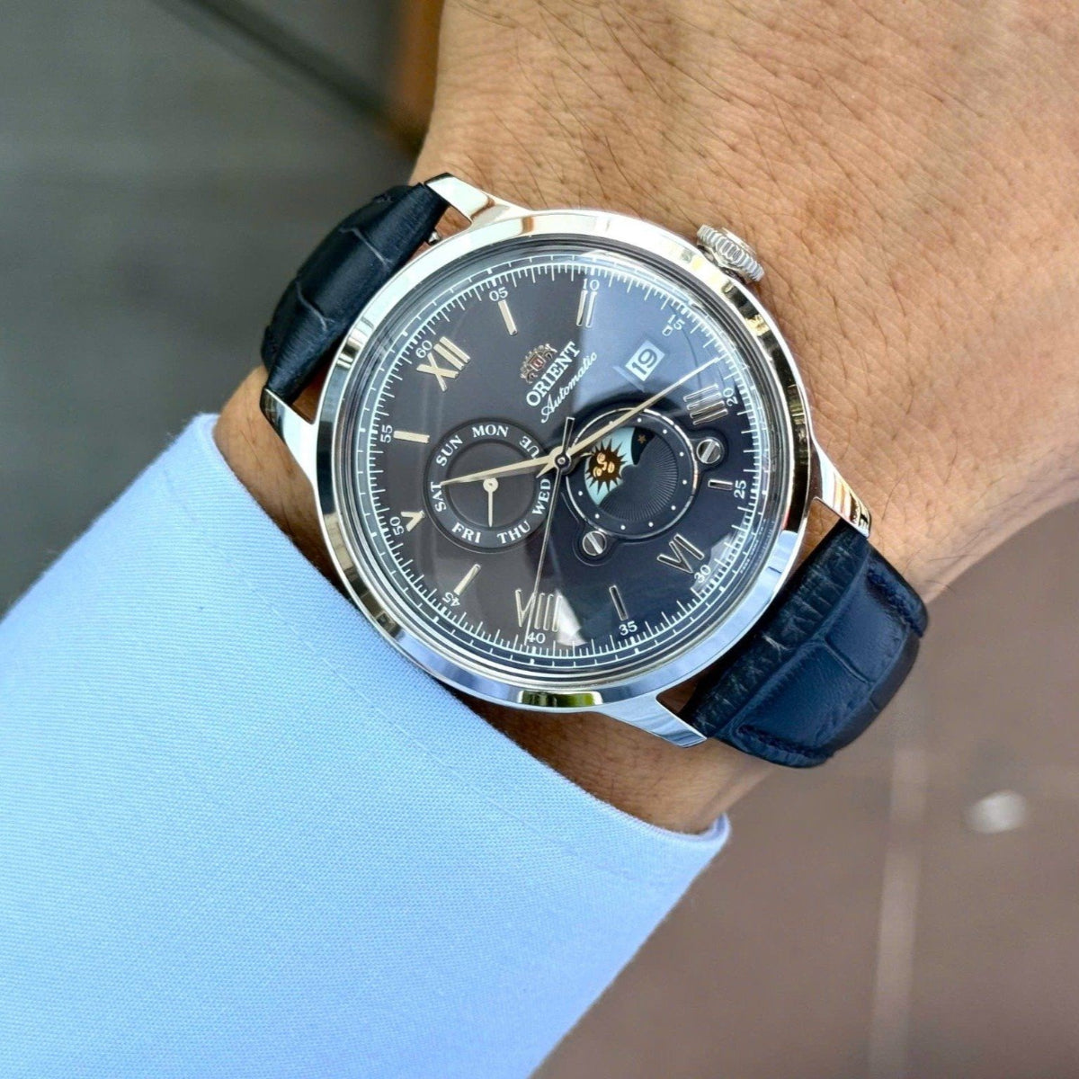 Orient Bambino RA-AK0806L30B sun & moon blue dial on wrist lifestyle view