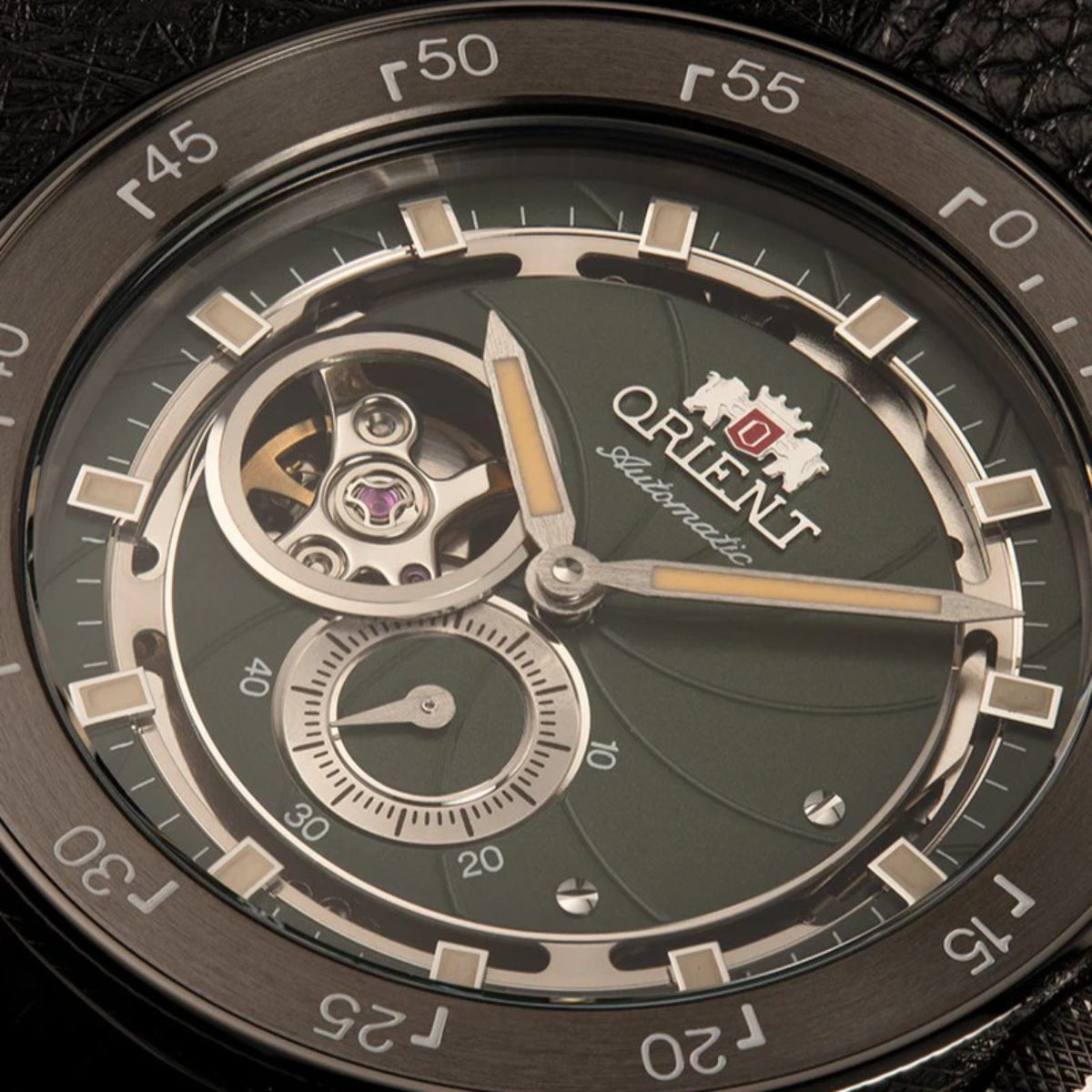 Men's automatic watch with green dial, date window, and visible movement